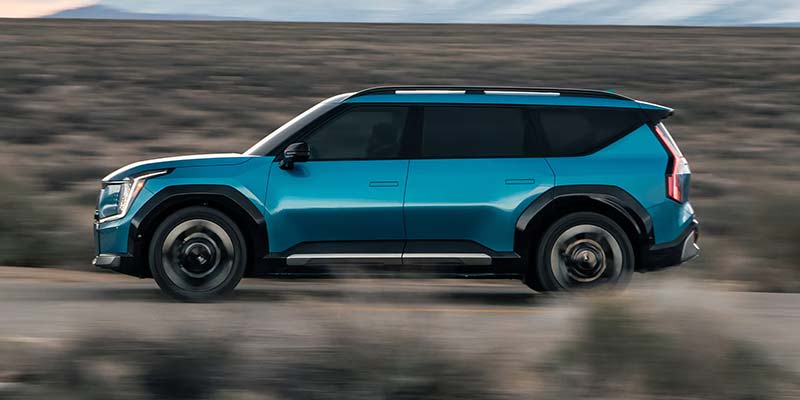 Side view of 2026 Kia EV9 driving